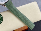 Green rubber watch strap with textured grid pattern and keeper buckle