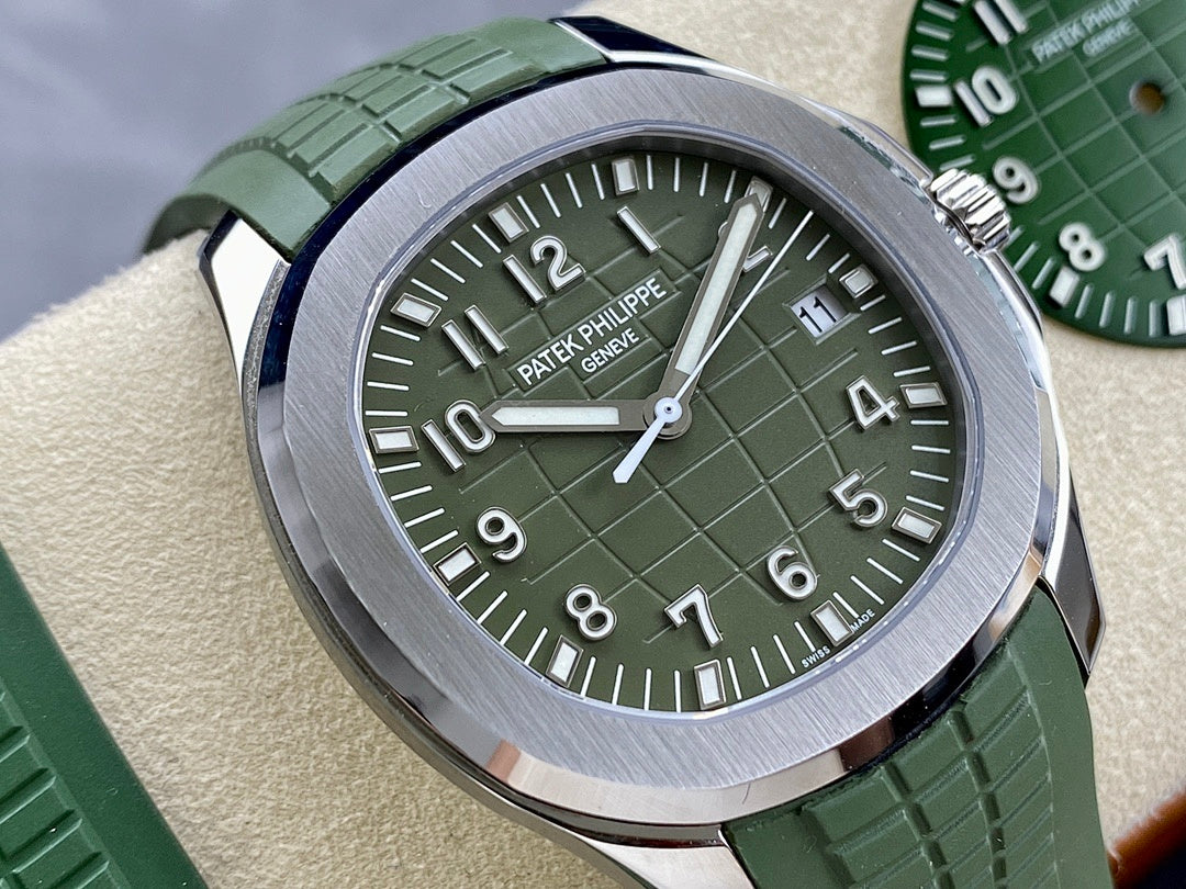 Green dial Patek Philippe wristwatch with silver case and green rubber strap