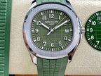 Green dial wristwatch with silver case and molded green rubber strap
