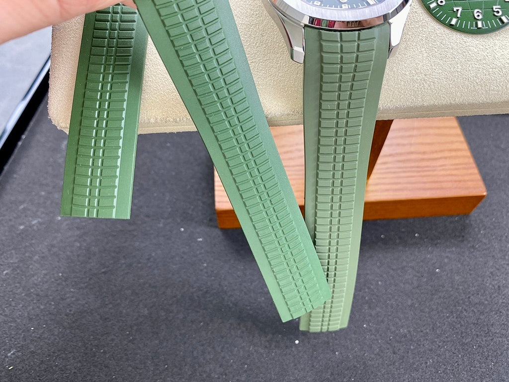 Green rubber watch straps arranged side by side with textured ridges