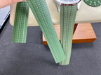 Green rubber watch straps arranged side by side with textured ridges