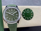 Green dial wristwatch with silver case and green rubber strap beside spare dial