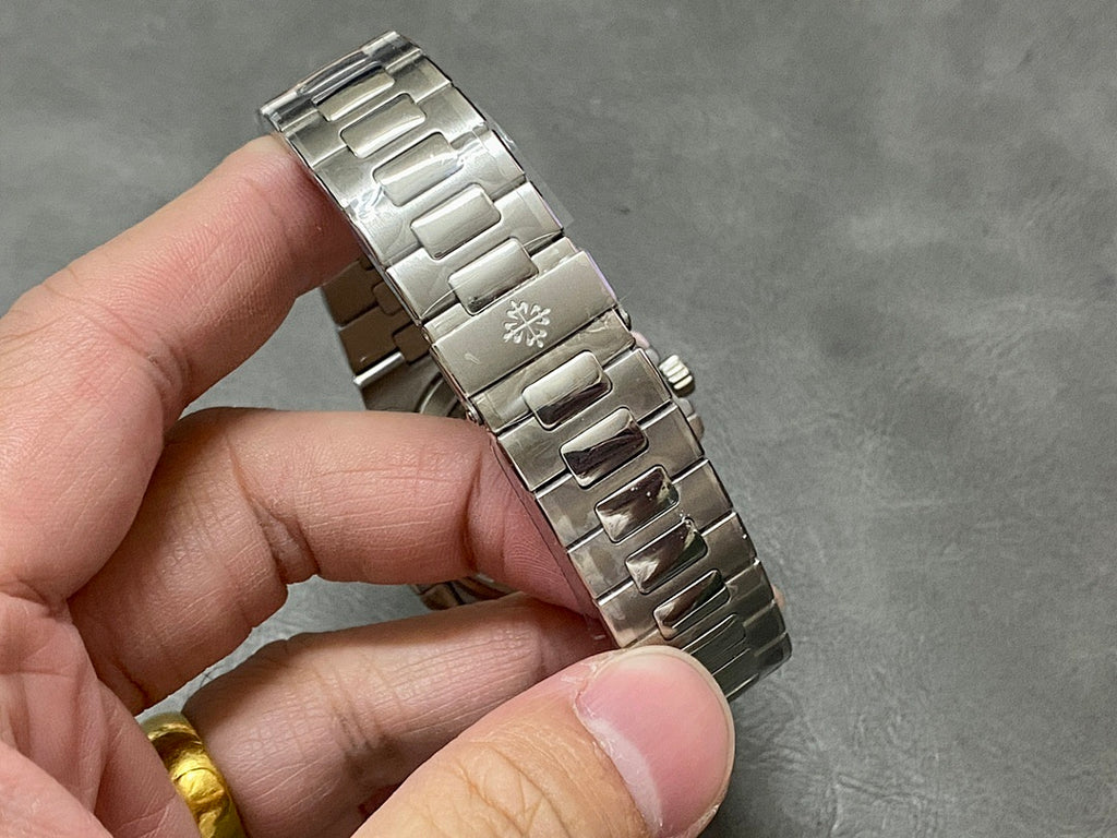 Patek Philippe watch bracelet with silver link pattern and clasp area