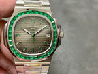 Patek Philippe watch front view with green bezel, gray dial, silver bracelet, date window 24