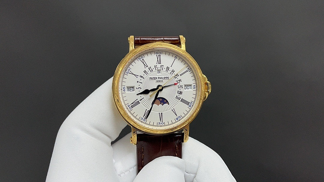 Patek Philippe watch with white dial, gold-tone case, brown leather strap.