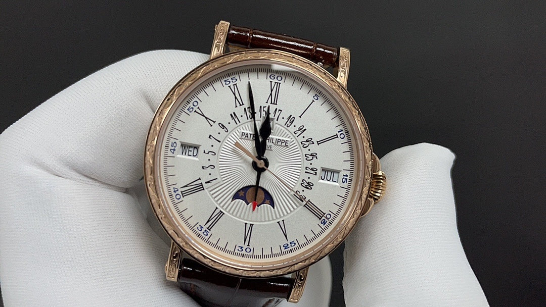 Patek Philippe watch front view with white dial, gold case, brown leather strap.