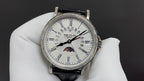 Patek Philippe wristwatch with white dial, date window, black leather strap