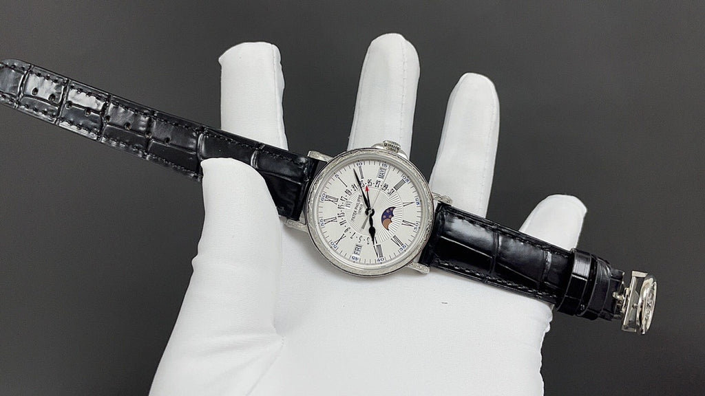 Patek Philippe wristwatch full view, white dial with multiple subdials, black leather strap