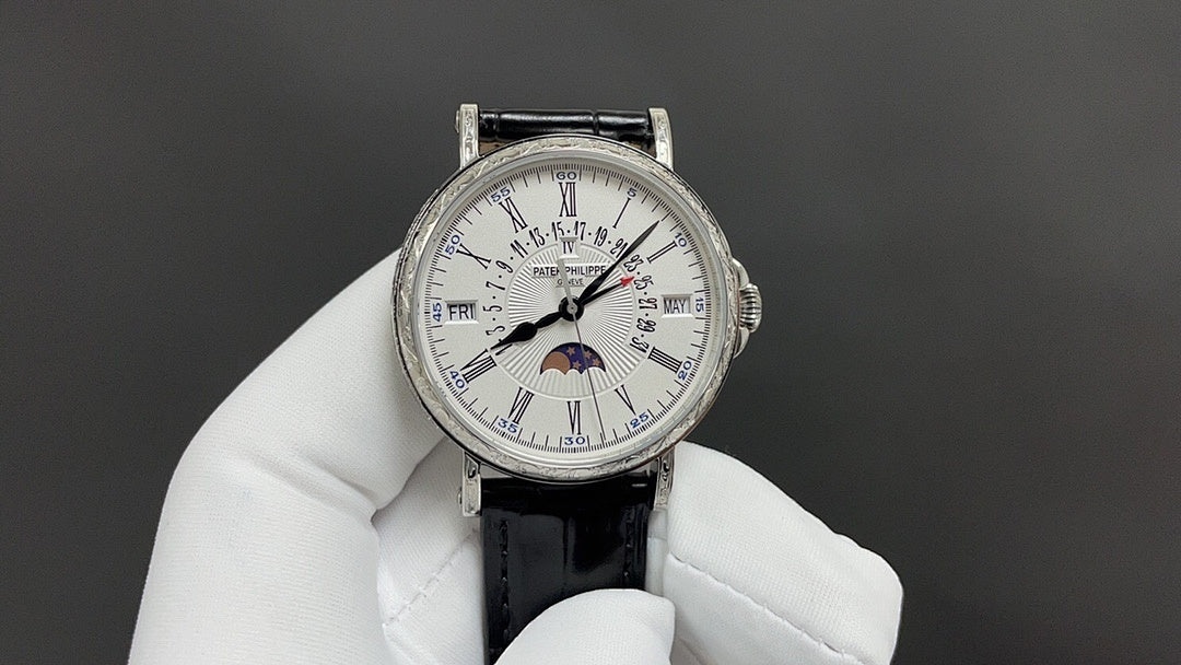Patek Philippe wristwatch with white dial and Roman numerals, black leather strap
