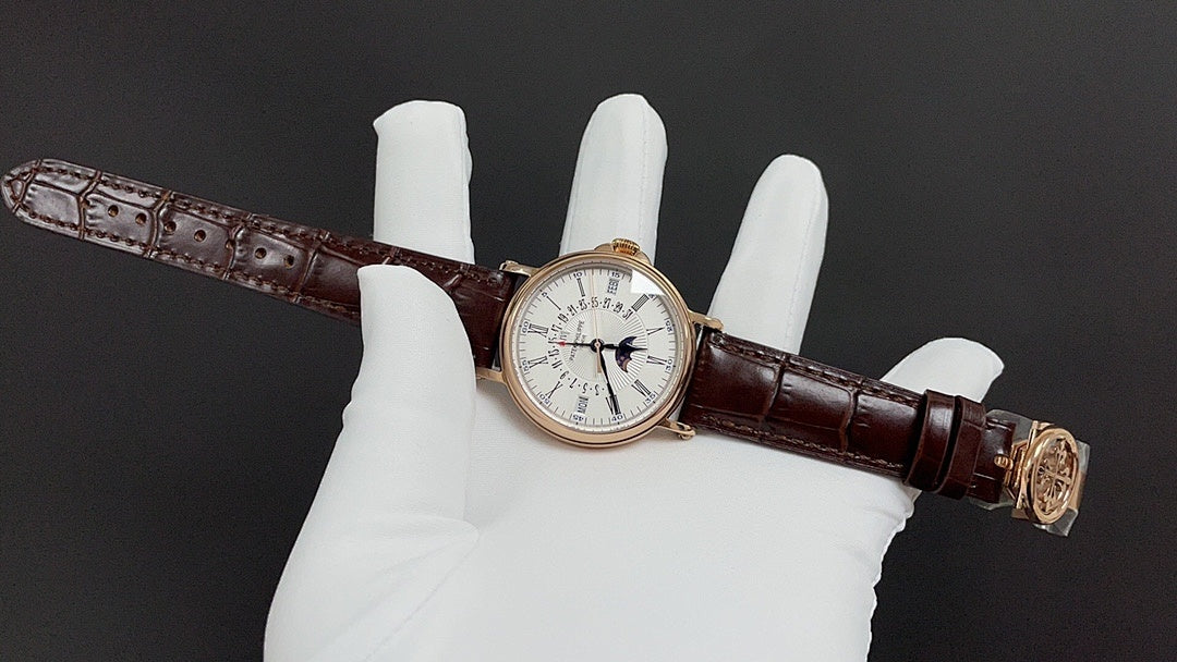 Patek Philippe wristwatch with white dial, dark brown leather strap and gold clasp