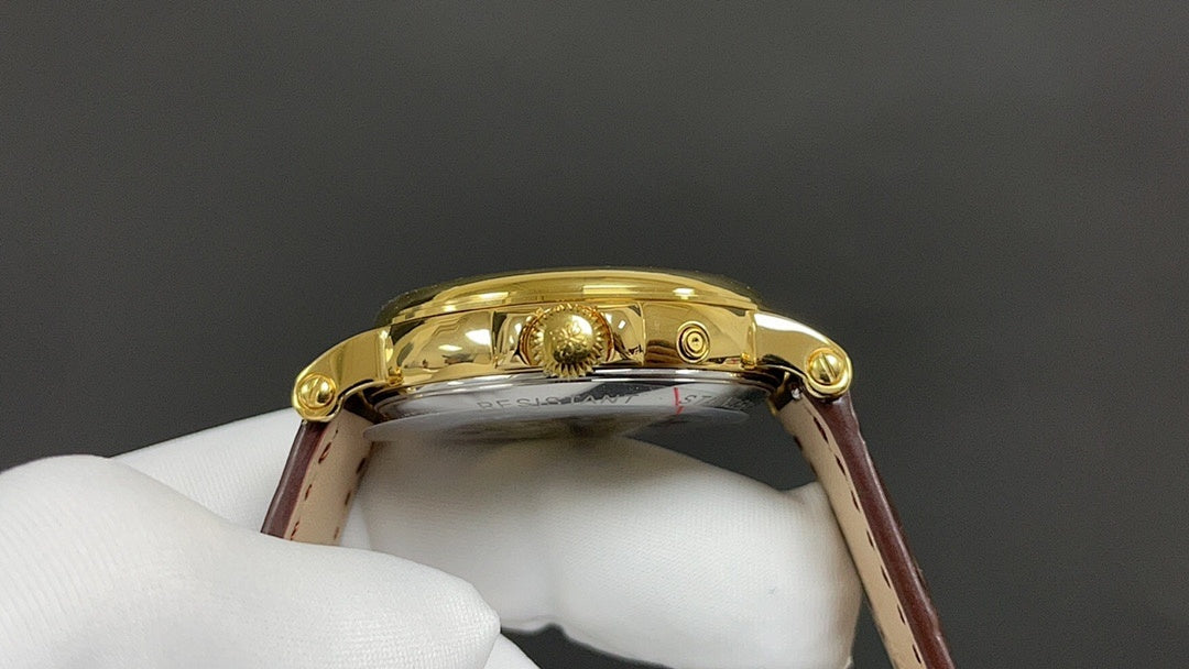 Patek Philippe wristwatch with gold-tone caseback, brown leather strap, crown and lug details