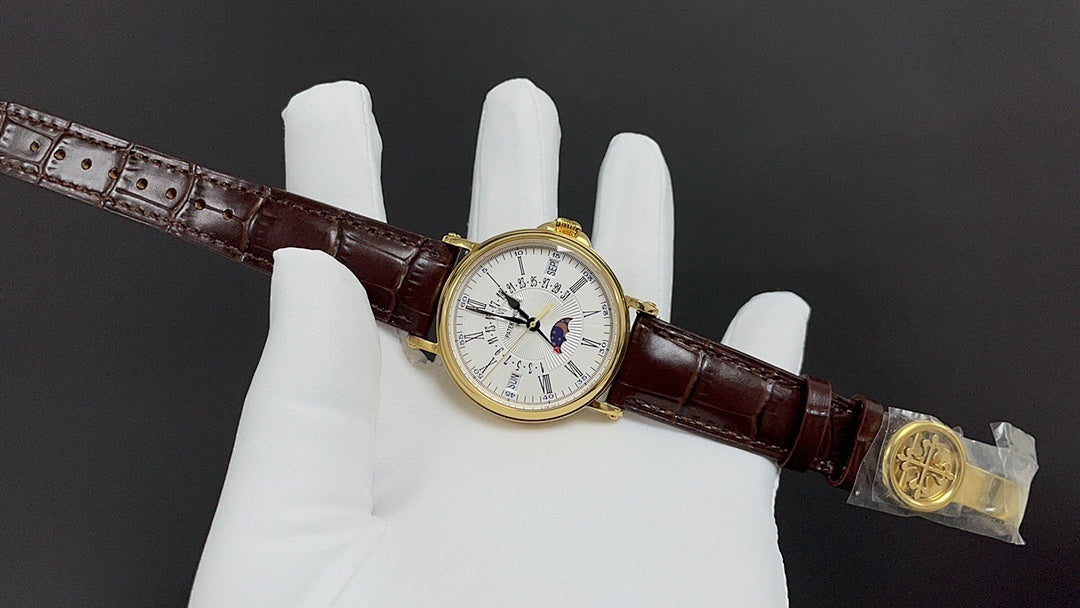 Patek Philippe wristwatch with brown leather strap, clasp detail and small white dial face