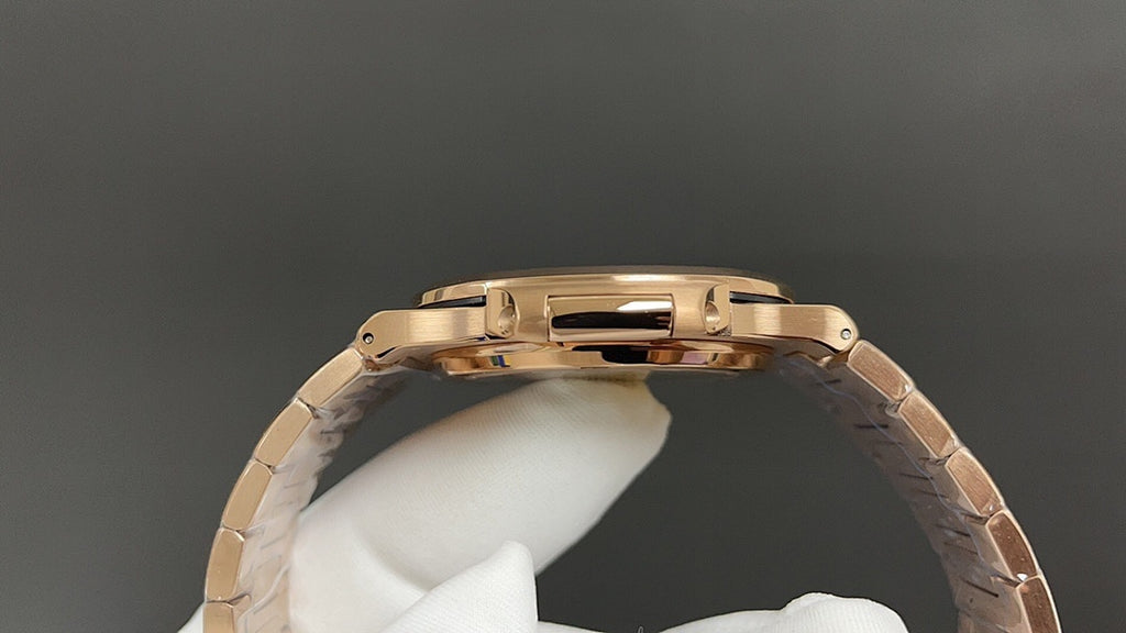 Gold-tone wristwatch case viewed from the side with textured bezel and lugs