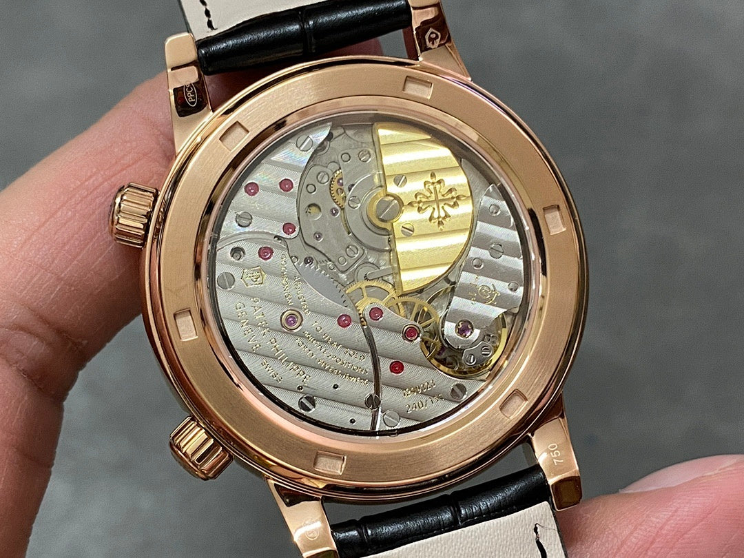 Luxury wristwatch with openwork dial showing gold-toned gears on black leather strap