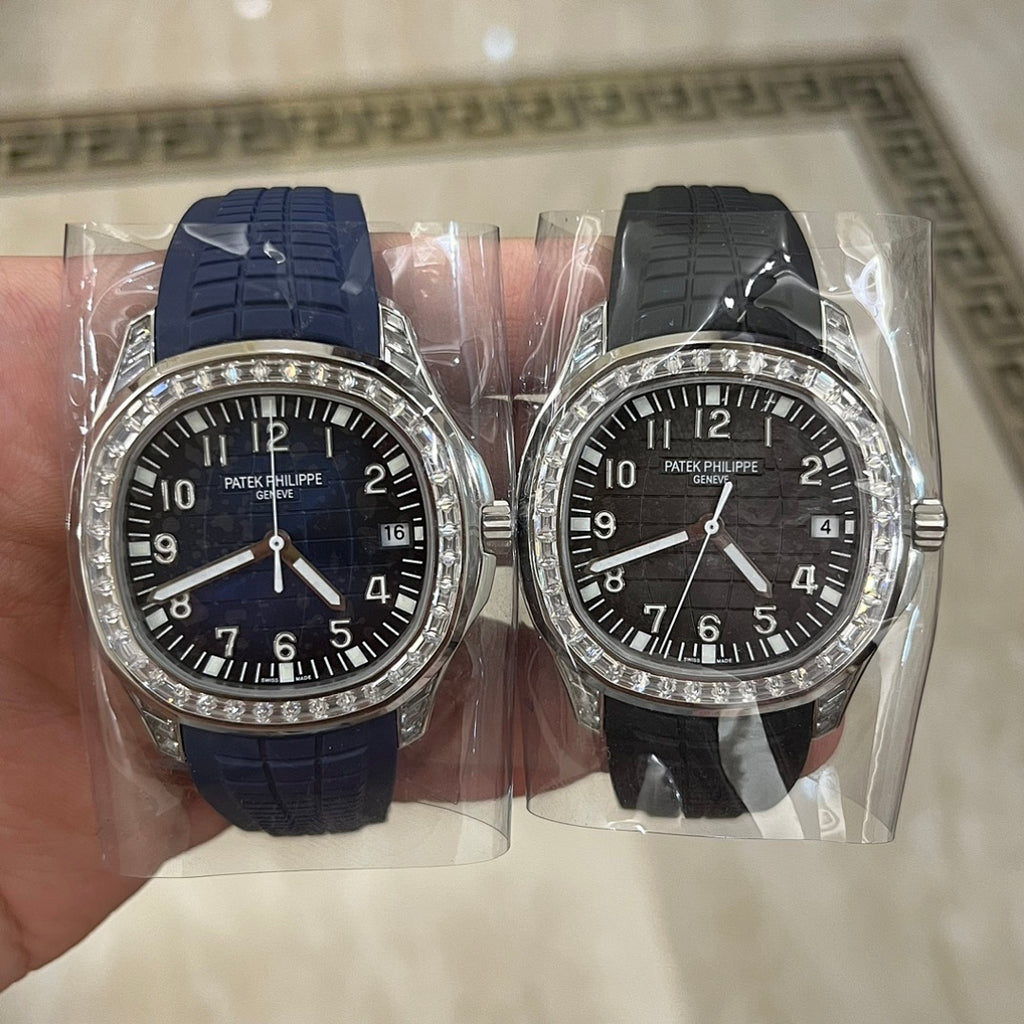 Patek Philippe watch set in plastic packaging, blue and black rubber straps, jeweled bezels