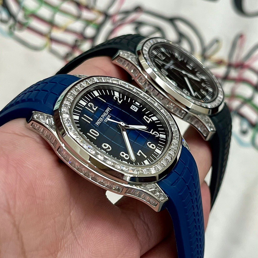 Luxury wristwatch with blue dial, jeweled bezel, and textured blue rubber strap