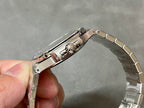Patek Philippe wristwatch side view with crown and integrated steel bracelet