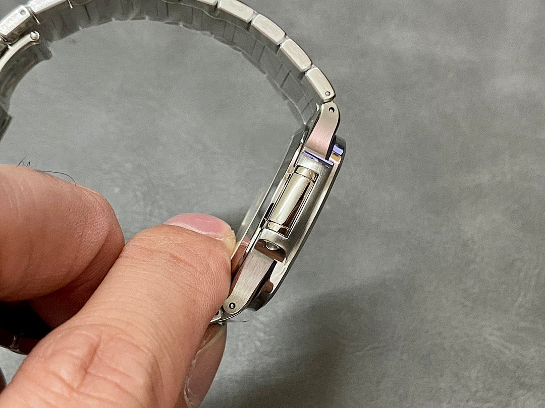 Patek Philippe watch clasp and links close-up on metal bracelet