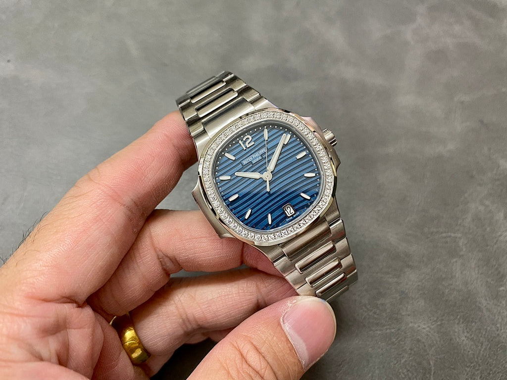 Patek Philippe wristwatch full front, blue dial with gold hands and diamond bezel