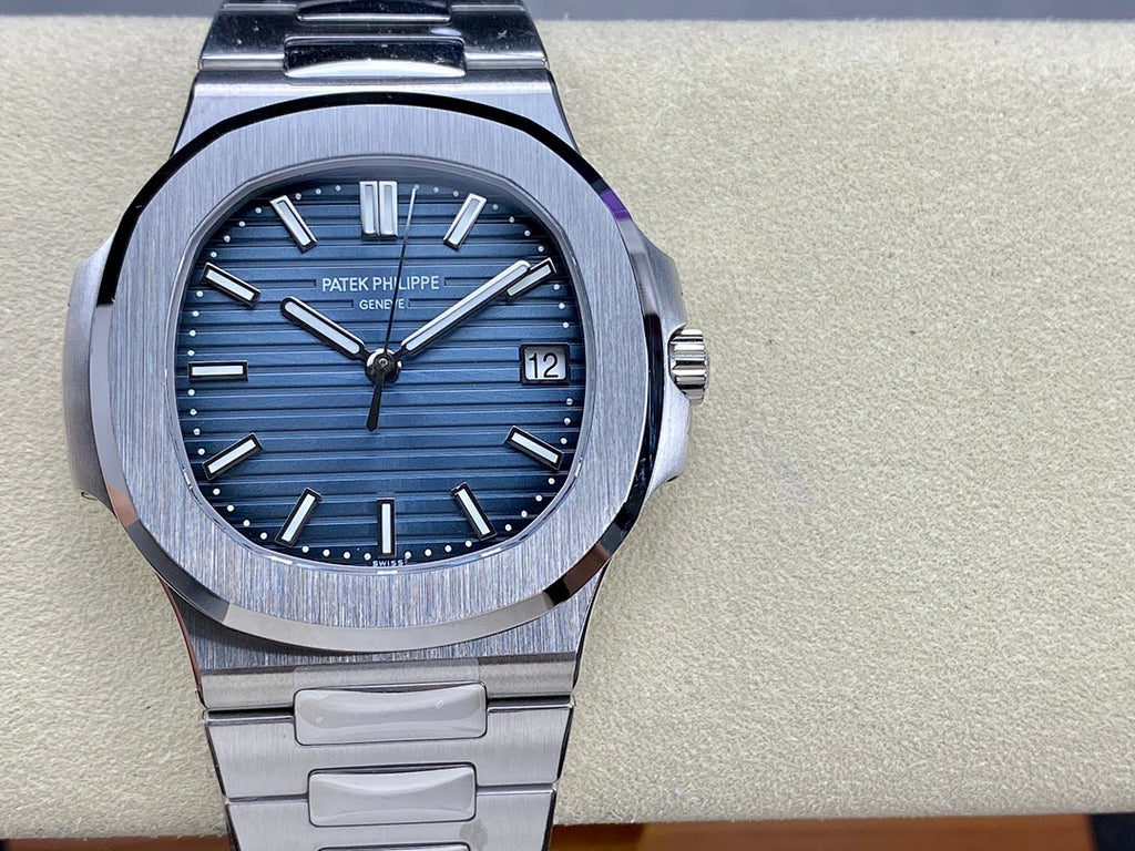 Patek Philippe steel wristwatch on bracelet with blue dial and date window at 12