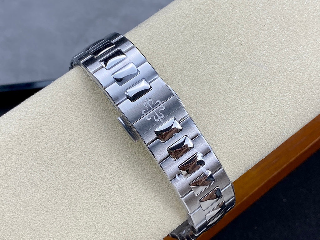 Patek Philippe steel watch bracelet with polished links and engraved accents