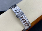 Patek Philippe steel watch bracelet with polished links and engraved accents