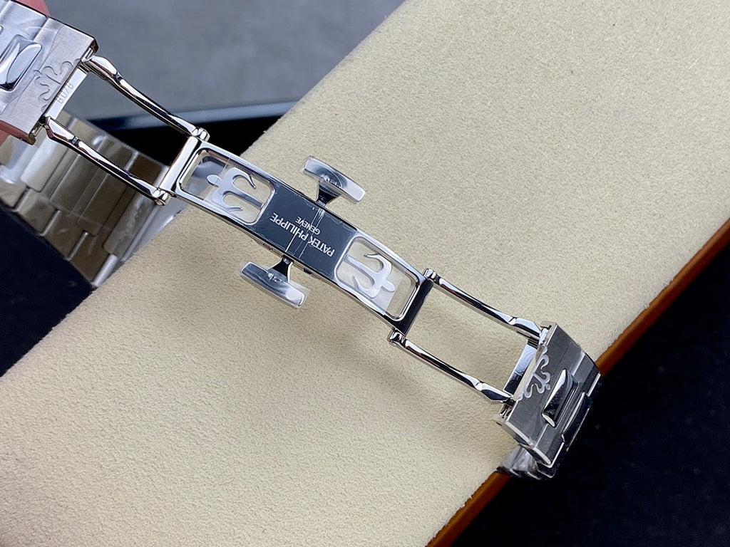 Patek Philippe steel deployment clasp with engraved markings and link segments