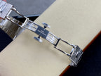 Patek Philippe steel deployment clasp with engraved markings and link segments