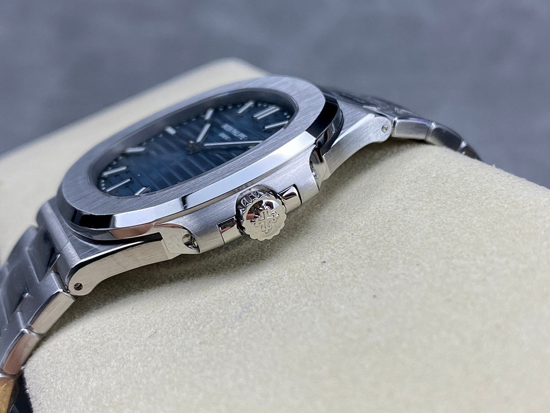 Patek Philippe steel wristwatch with blue dial and crown on the right side