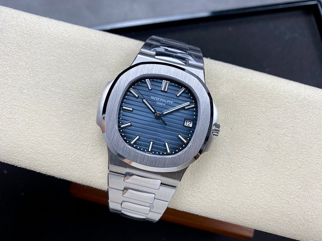 Patek Philippe steel wristwatch with blue dial and date window at 12 o’clock