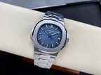 Patek Philippe steel wristwatch with blue dial and date window at 12 o’clock