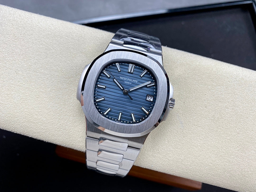 Patek Philippe steel wristwatch with blue dial and date window at 12 o’clock