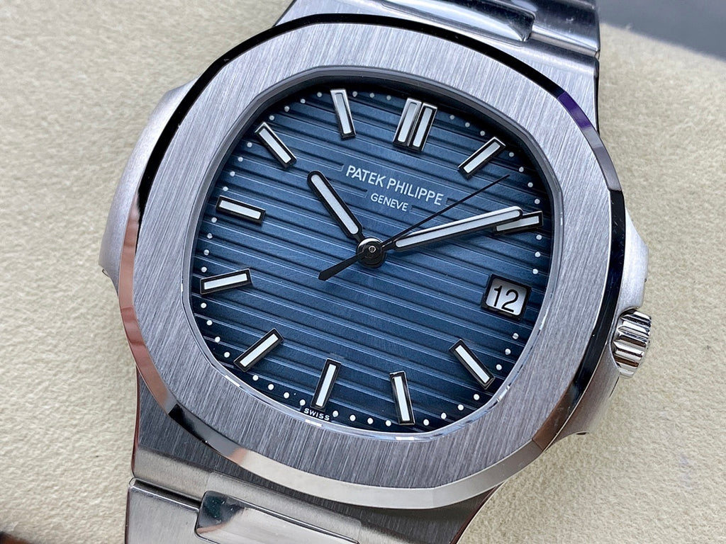 Patek Philippe steel wristwatch with blue dial, baton markers, date at 12 o’clock