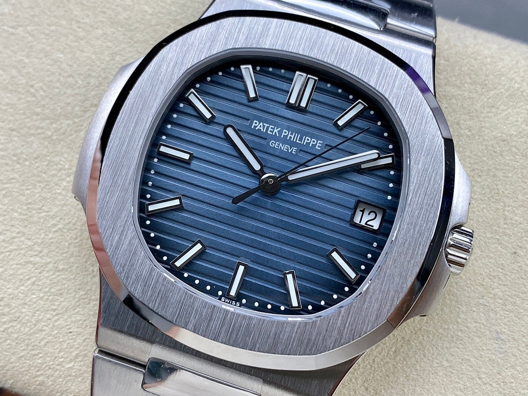 Patek Philippe steel wristwatch with blue dial, baton markers, date at 12 o’clock