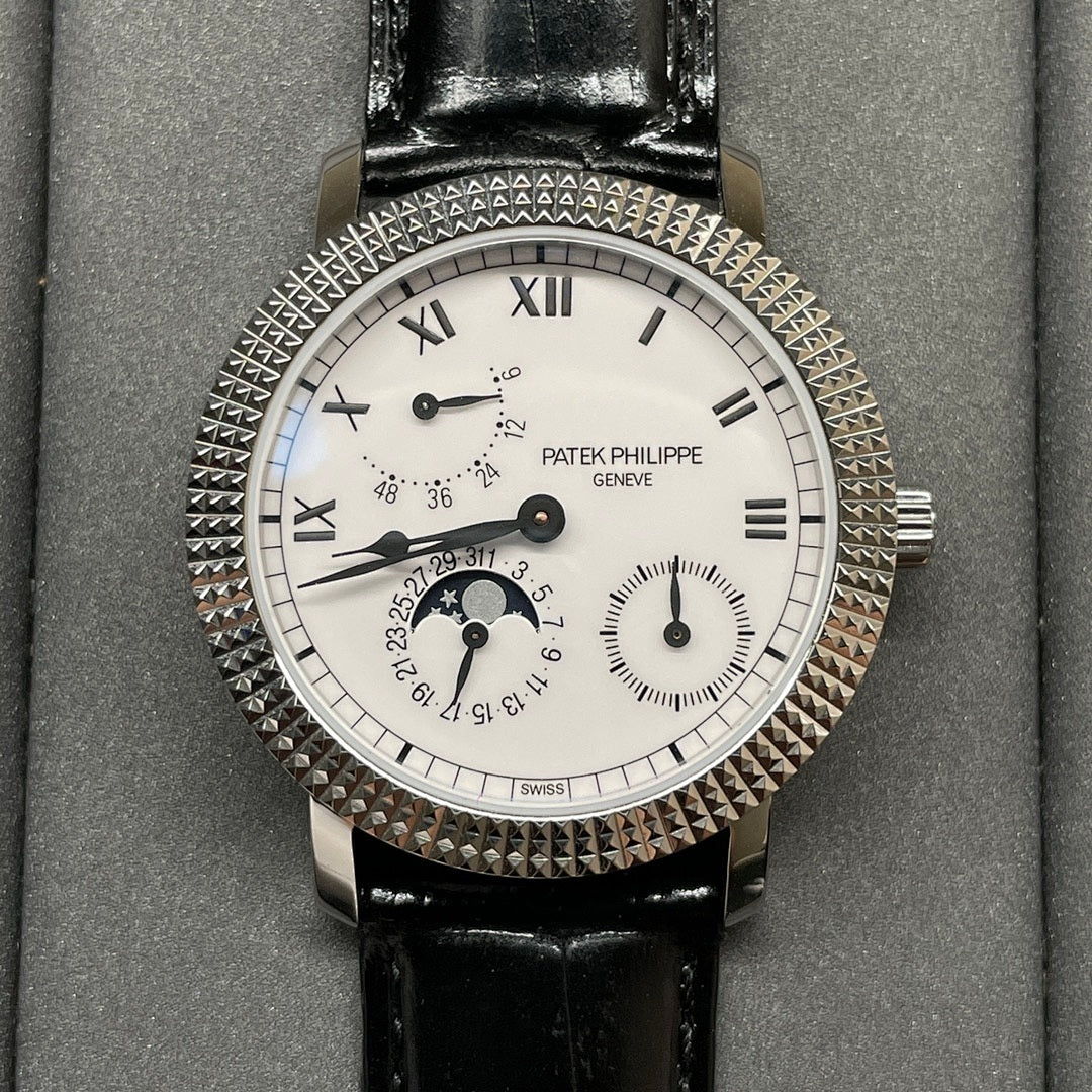 Patek Philippe watch with white dial, black leather strap, textured jeweled bezel