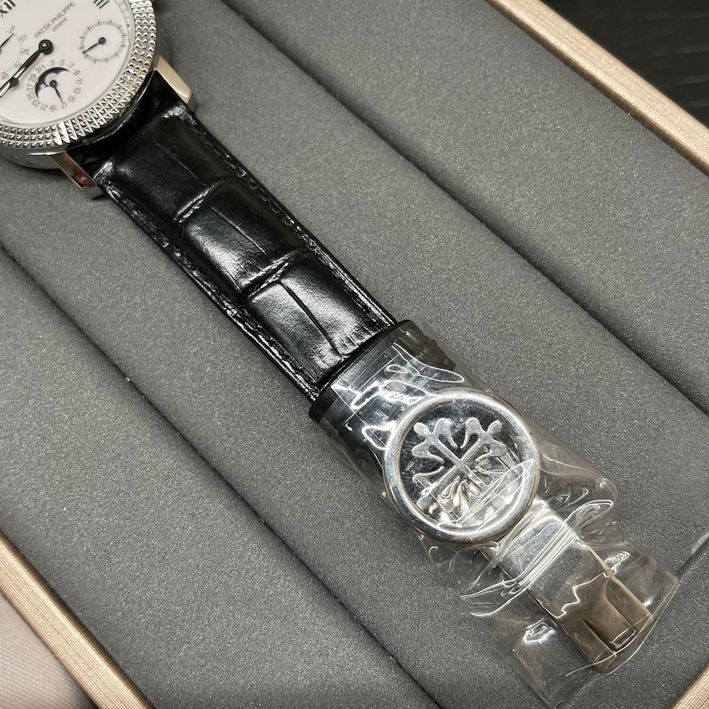 Patek Philippe watch with black leather strap and silver clasp buckle