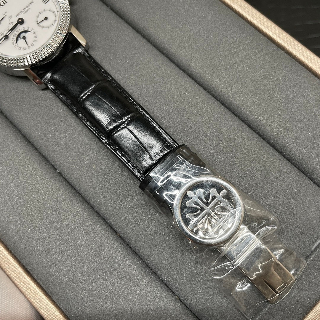 Patek Philippe watch with black leather strap and silver clasp buckle