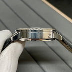 Patek Philippe watch case with metal clasp and black leather strap