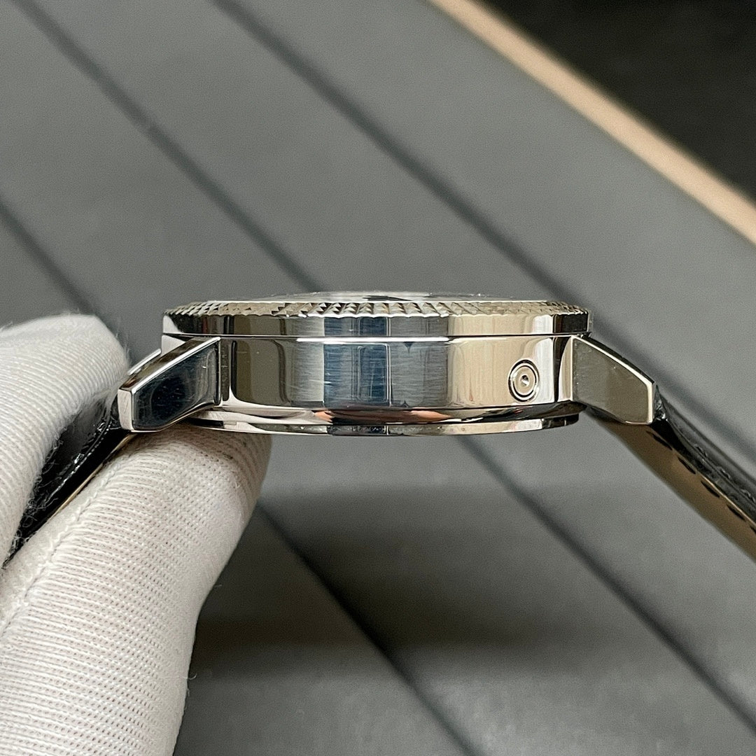 Patek Philippe watch case with metal clasp and black leather strap