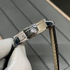 Patek Philippe watch side detail with crown and black leather strap