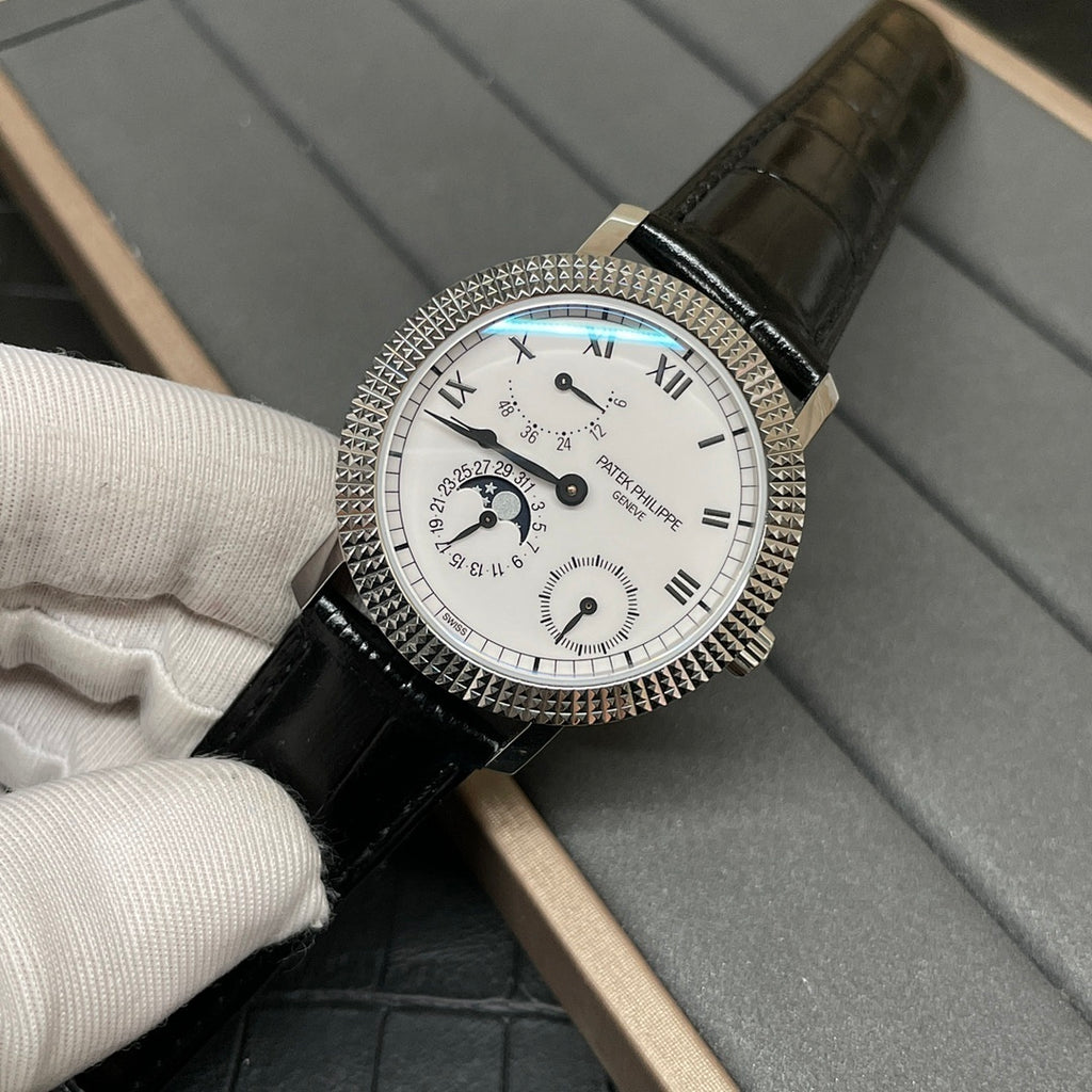 Patek Philippe watch with white dial, Roman numerals, black leather strap