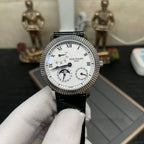 Patek Philippe watch front with white dial, subdials, and black leather strap