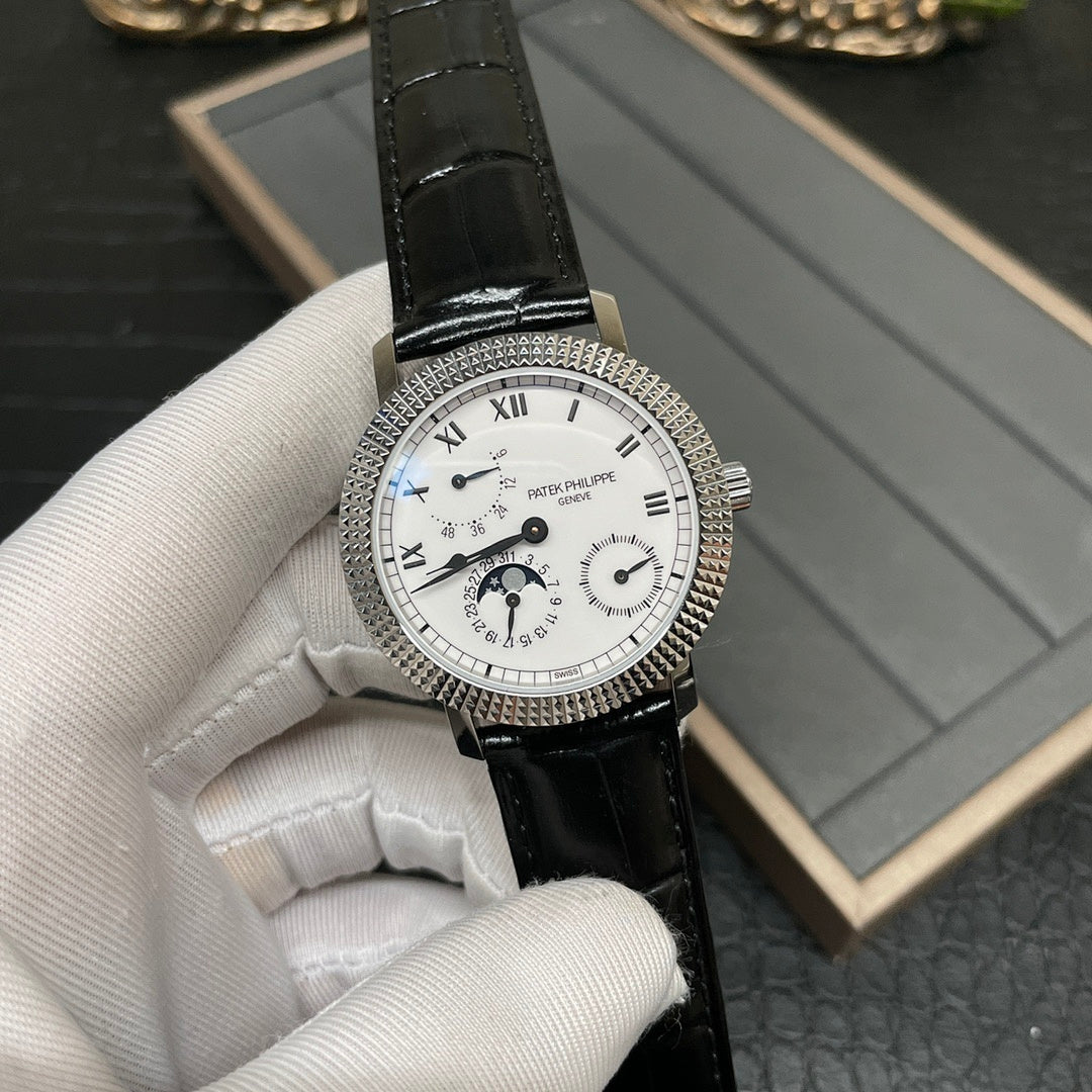 Patek Philippe watch front with white dial and black leather strap