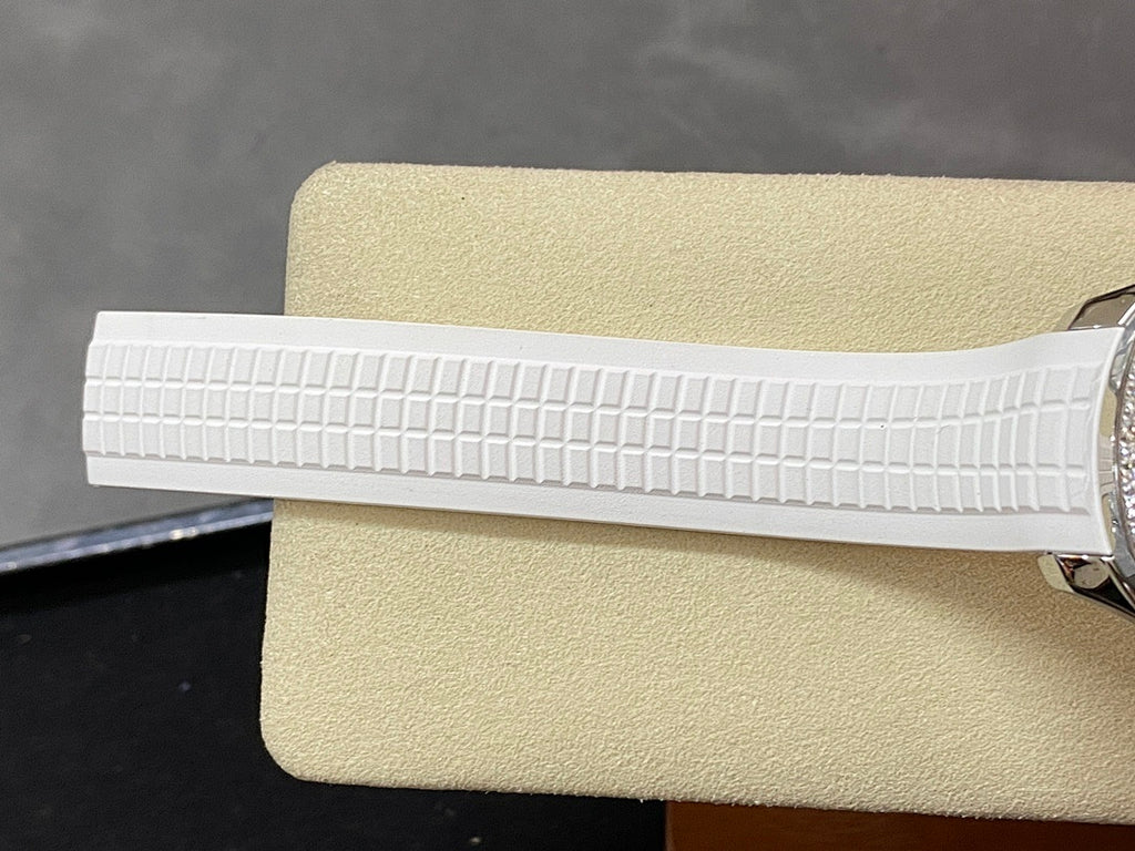 White textured rubber watch strap segment, side view