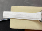 White textured rubber watch strap segment, side view