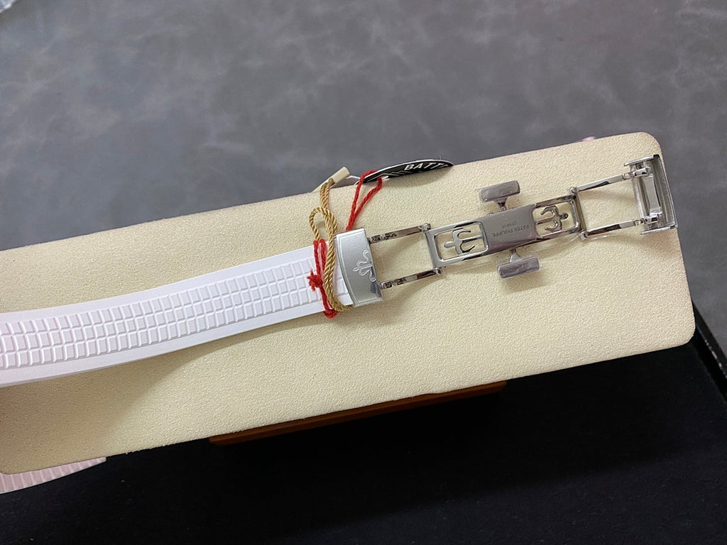 White rubber watch strap with metal clasp and buckle, side view