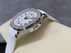 Diamond bezel watch with white dial and white textured rubber strap, 3/4 view
