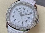 Diamond bezel watch with white dial and white textured rubber strap, close-up view