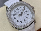 Diamond bezel watch with white dial and date window, close-up front view