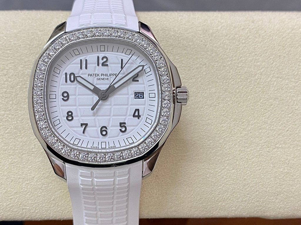 Diamond bezel watch with white dial and white textured rubber strap, centered front view